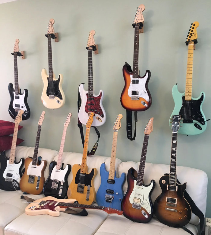 Several electric guitars on display for sale